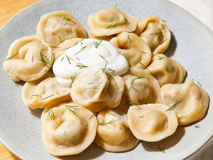 Pelmeni (Пельмени) Pelmeni (Пельмени) - Siberian meat dumplings served in broth or with butter. Comfort food at its finest.