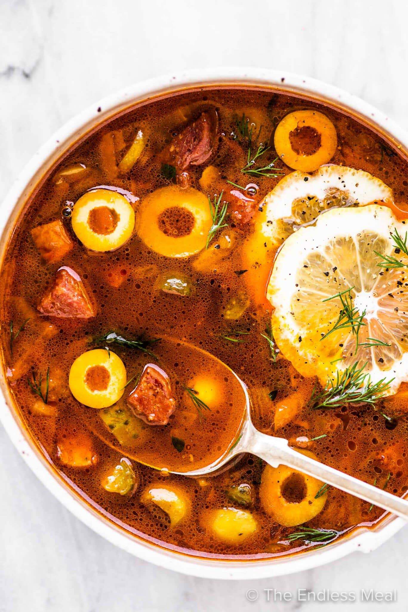 Solyanka (Солянка) Solyanka (Солянка) - Hearty soup with mixed meats, pickles, and olives. Rich, tangy, and deeply satisfying.