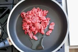 Cook the meat: Meanwhile, Set aside about 1 tablespoon of mixed nuts and heat a wok or large skillet over medium high heat. Stir fry the ground pork or beef tasting add a tablespoon of oil until brown browned and cooking through. Take off of the wok and set aside.