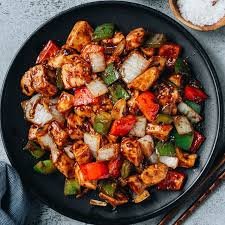 Sauté aromatics: Pour a second tablespoon of oil in the same wok. The minute the garlic and ginger begin to sizzle, stir in the minced fermented black beans and cook, about 30 seconds.